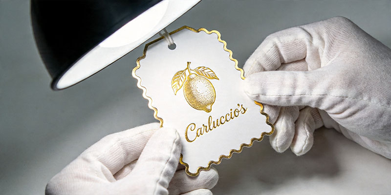 Operator inspecting a foil-stamped greeting card